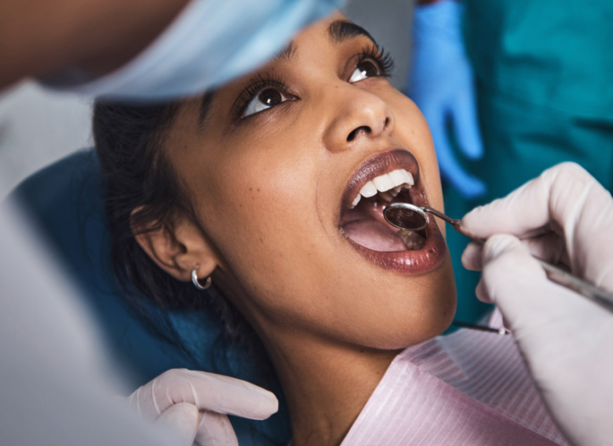 Woman undergoing dental exam
